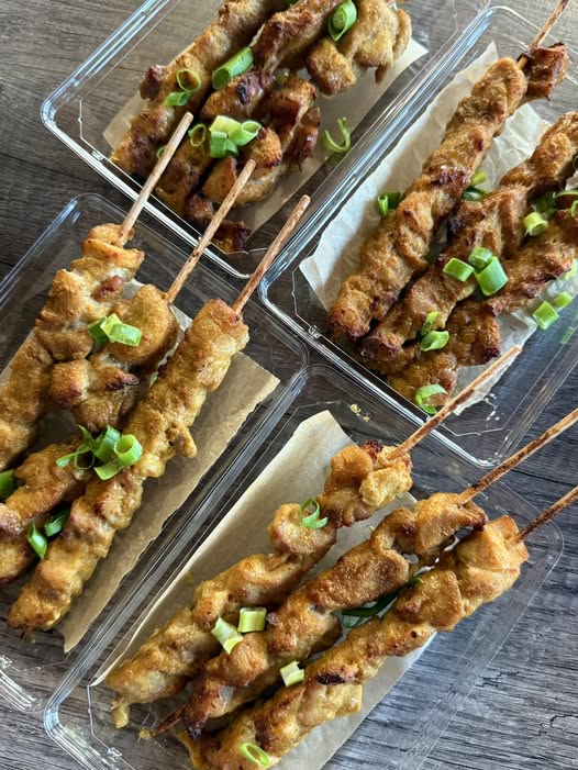 Tender chicken satay sticks grilled to perfection, served with a rich and creamy peanut sauce.